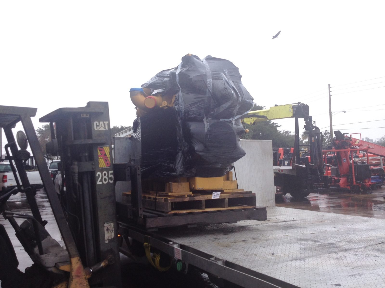 The replacement C15 arriving on a flatbed