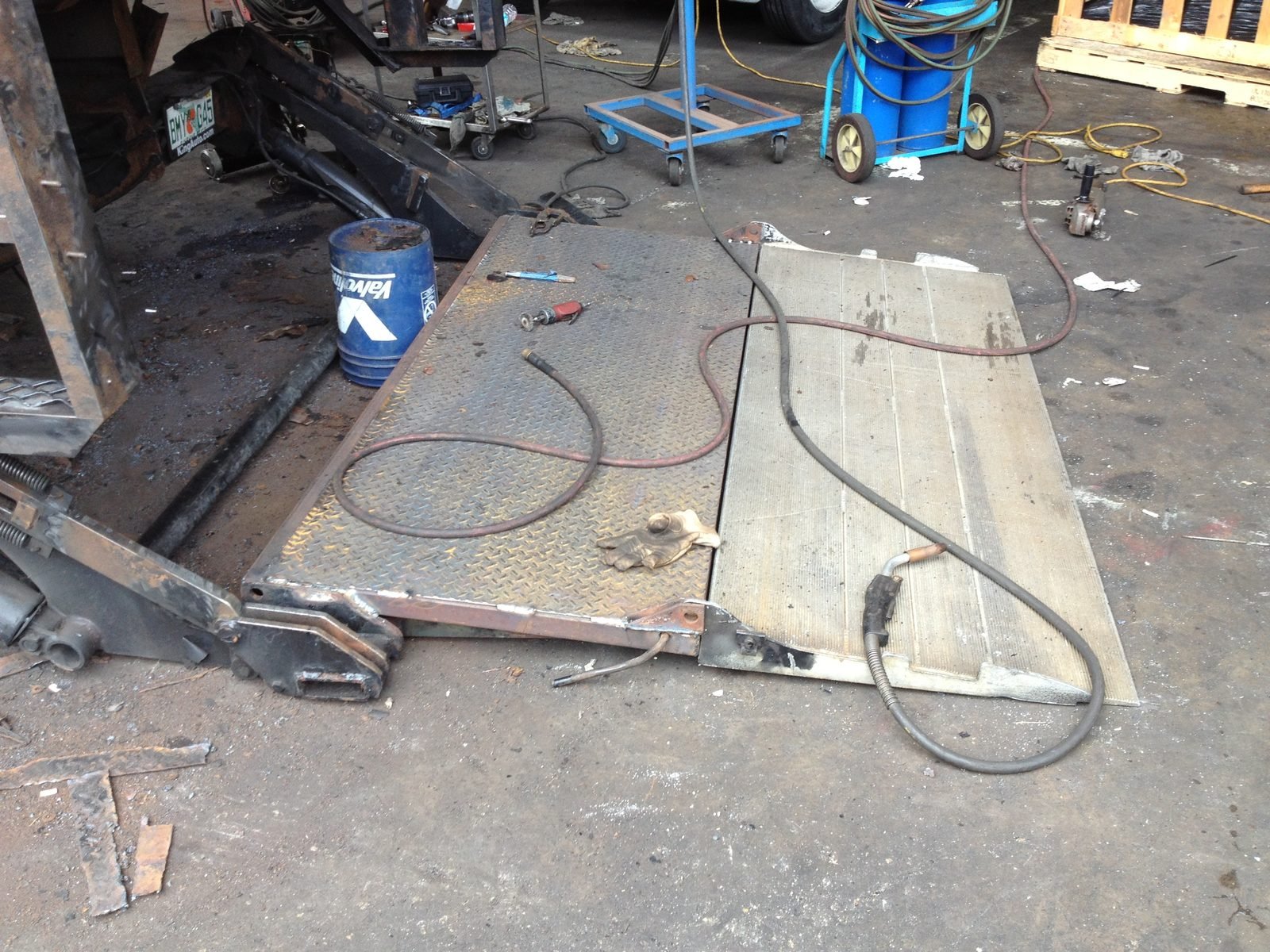 A new deck plate welded into a rebuilt lift gate platform